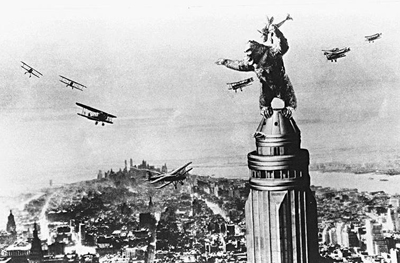 King Kong battles biplanes atop of New York's Empire State Building.