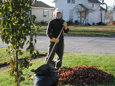 Photo of Chad Kerychuk raking leaves.