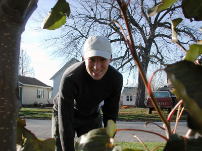 Another photo of Chad Kerychuk raking leaves.